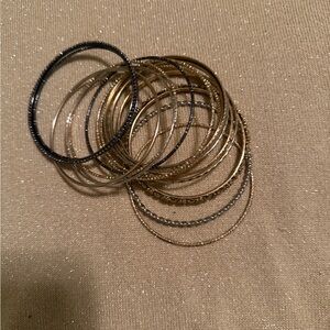 Elegant Gold, Silver, black, brown Bangle Set
3” across 16 rings